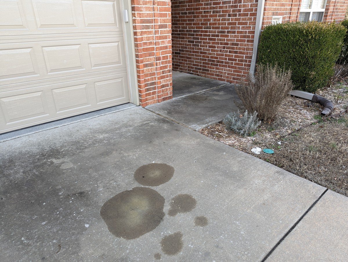 Driveway before pressure washing in Bentonville AR