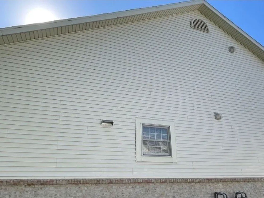 House after soft washing in Rogers AR